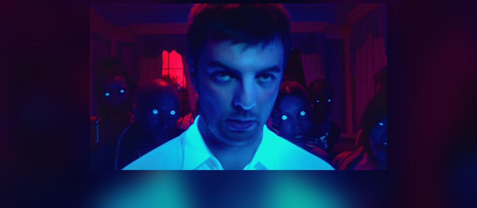 Grian Chatten in Fontaines D.C.'s Marianne video, surrounded by figures with glowing eyes